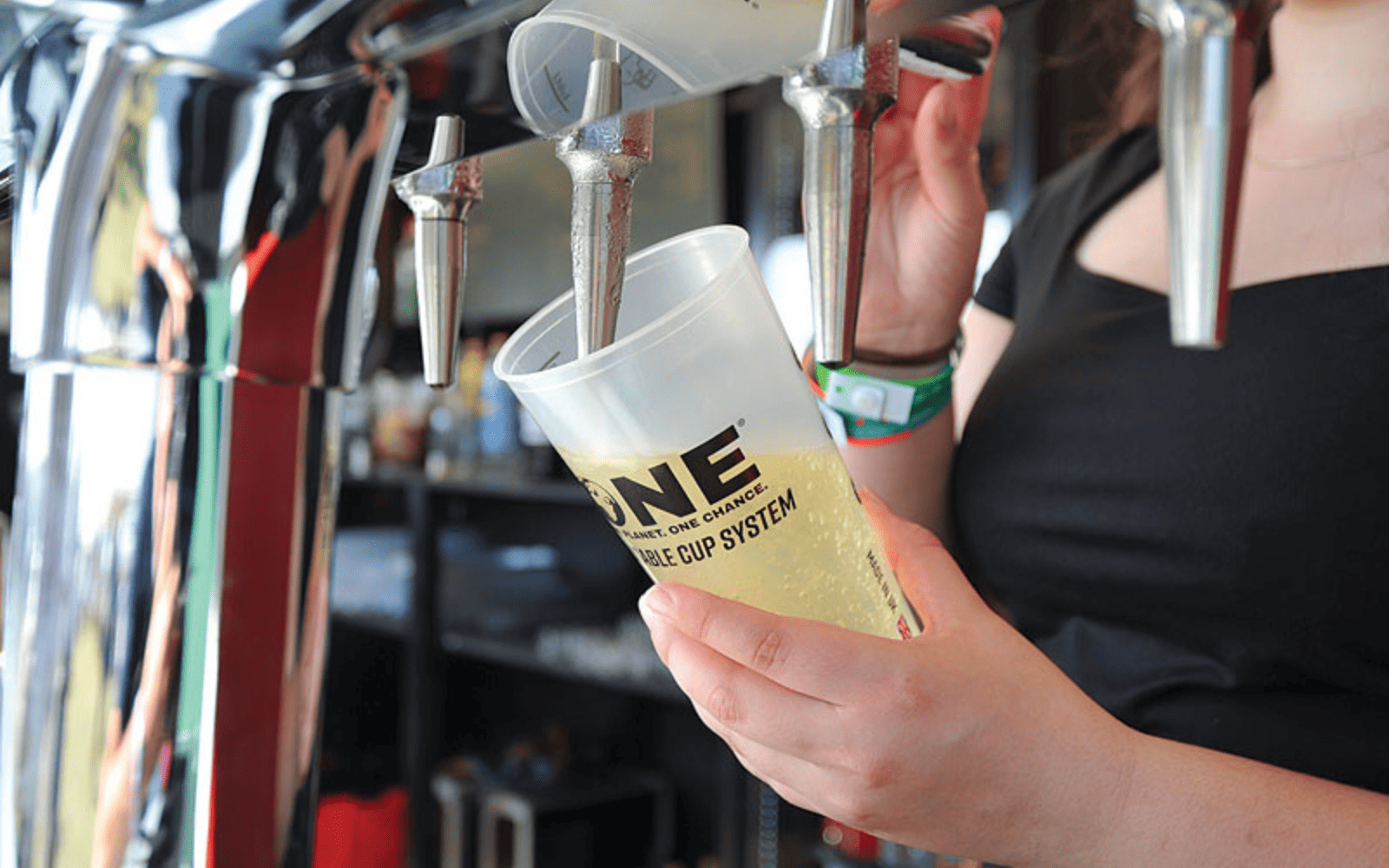 beer being poured from tap into One Cup