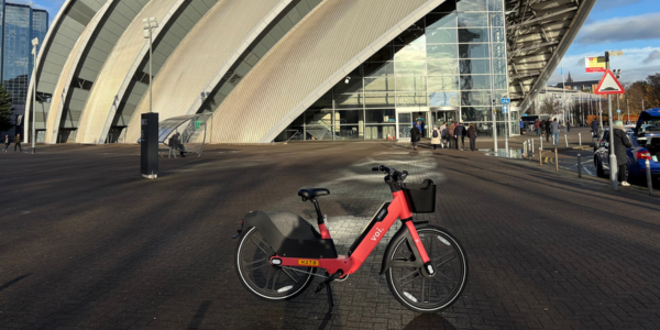 Voi bike standing outside the SEC Armadillo
