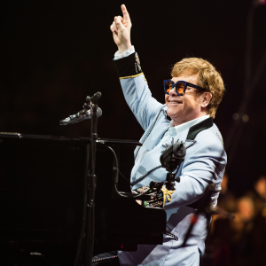 Elton John playing the piano at the OVO Hydro
